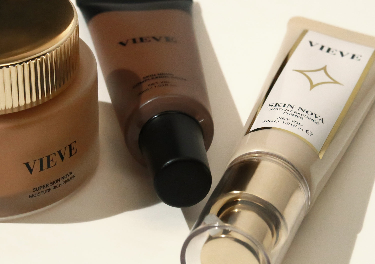 Three Vieve Skin Nova products laid side by side — Super Skin Nova Moisture Rich Primer in a jar, Skin Nova Complexion Balm in a squeeze tube, and Skin Nova Instant Radiance Primer in a pump bottle.